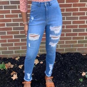 Fashion Nova distressed skinny jeans.
